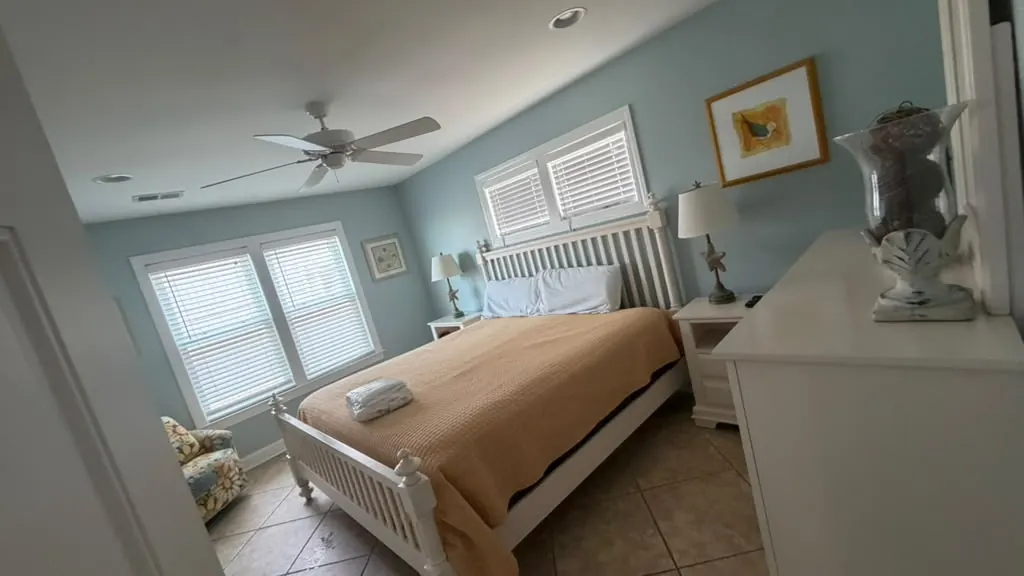 Clean, tidy bedroom with a made bed